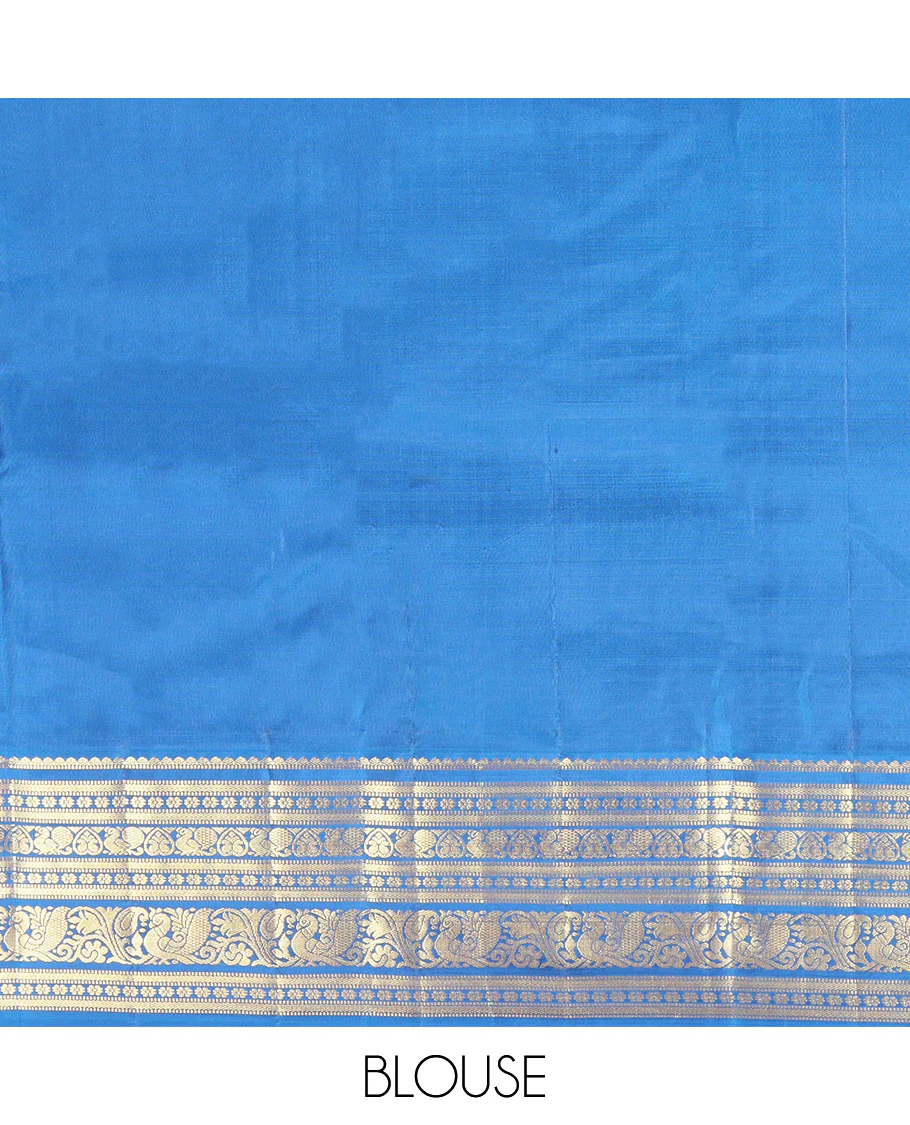 Red Vasundhara Silk Saree, Subtly Sparkled With Zari Buttas All Over Its Body, Complemented by Contrast Border of Salngai, Muthu, Kamalam, Jada Nagam, and Mayil Designs, Grand Pallu and Paired with a Contrast Blouse - Image 6