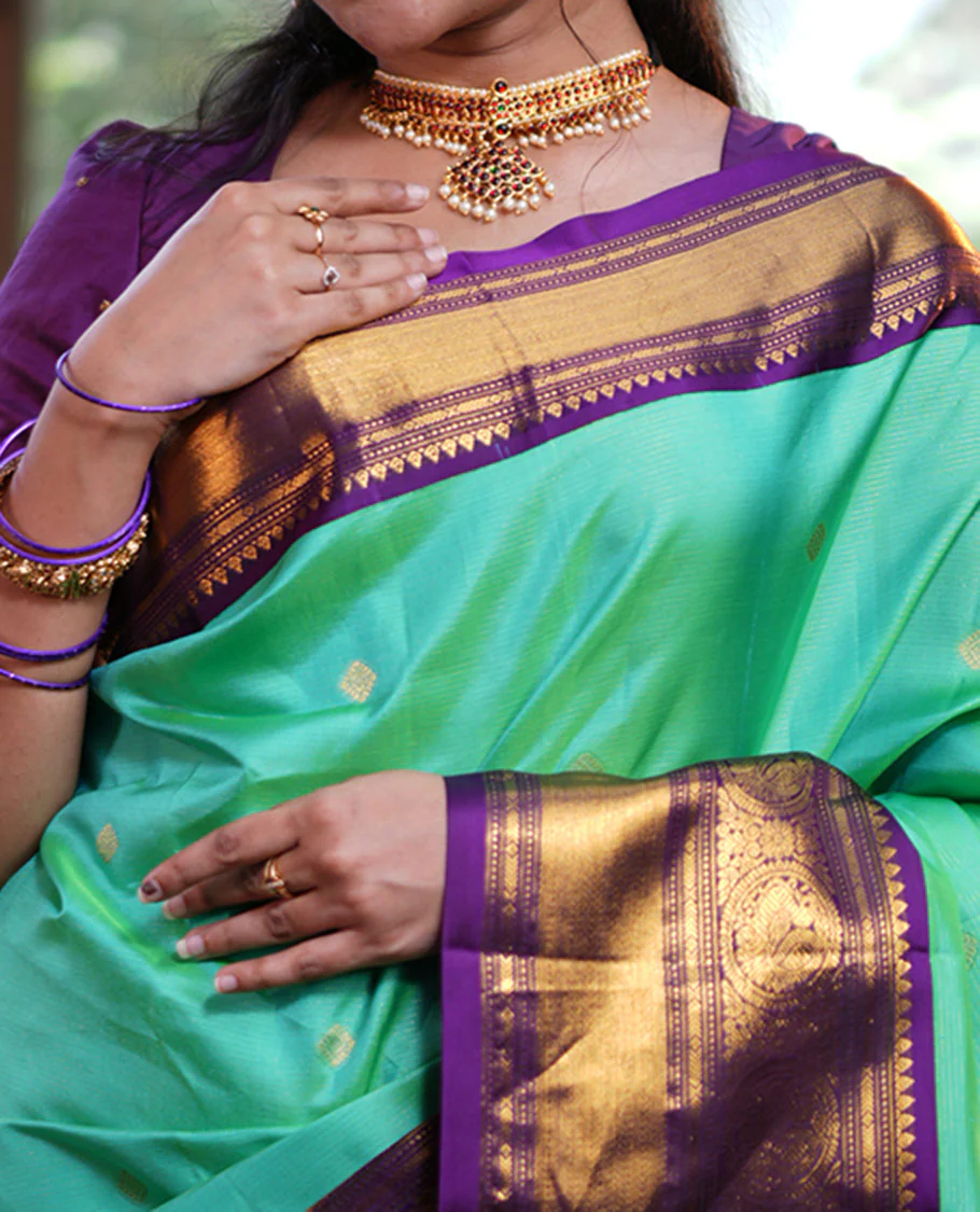 Rexona Green Vasundhara Silk Saree, Beautified with Sparse Stripes and Zari Buttas, Complemented by a Contrast Border of Thilakam, Banaras, Muthu, and Round Mayil Designs, Pallu Steeped with Traditional Designs, and Paired with a Contrast Blouse - Image 2