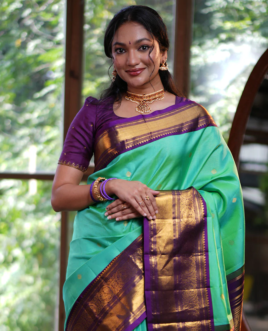 Rexona Green Vasundhara Silk Saree, Beautified with Sparse Stripes and Zari Buttas, Complemented by a Contrast Border of Thilakam, Banaras, Muthu, and Round Mayil Designs, Pallu Steeped with Traditional Designs, and Paired with a Contrast Blouse - Image 3