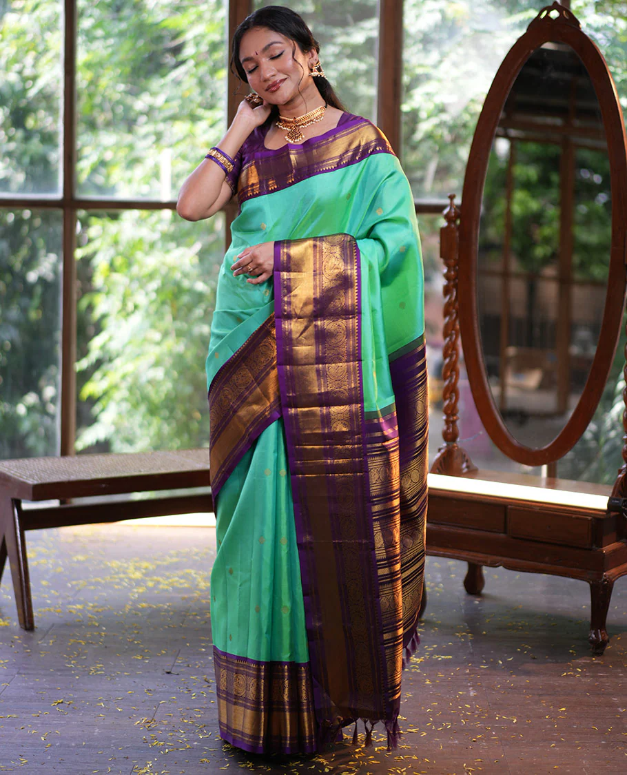 Rexona Green Vasundhara Silk Saree, Beautified with Sparse Stripes and Zari Buttas, Complemented by a Contrast Border of Thilakam, Banaras, Muthu, and Round Mayil Designs, Pallu Steeped with Traditional Designs, and Paired with a Contrast Blouse - Image 4