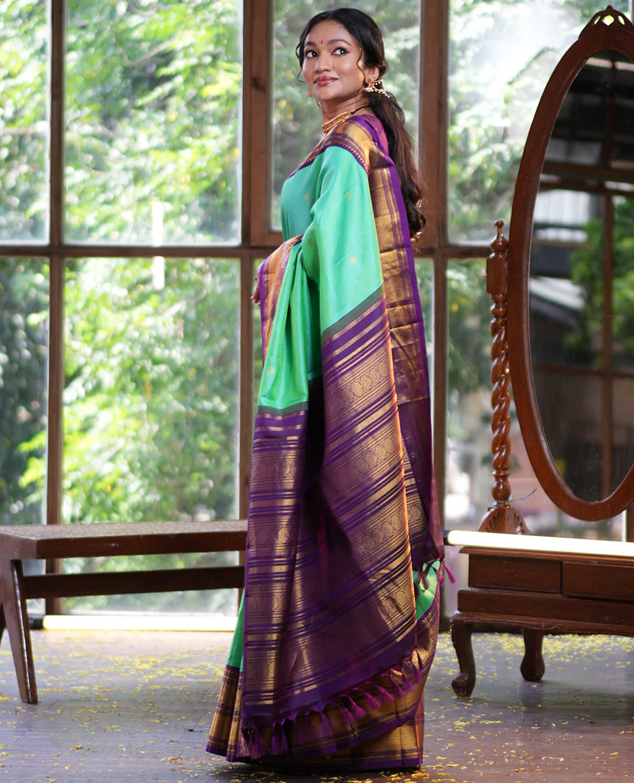 Rexona Green Vasundhara Silk Saree, Beautified with Sparse Stripes and Zari Buttas, Complemented by a Contrast Border of Thilakam, Banaras, Muthu, and Round Mayil Designs, Pallu Steeped with Traditional Designs, and Paired with a Contrast Blouse - Image 5