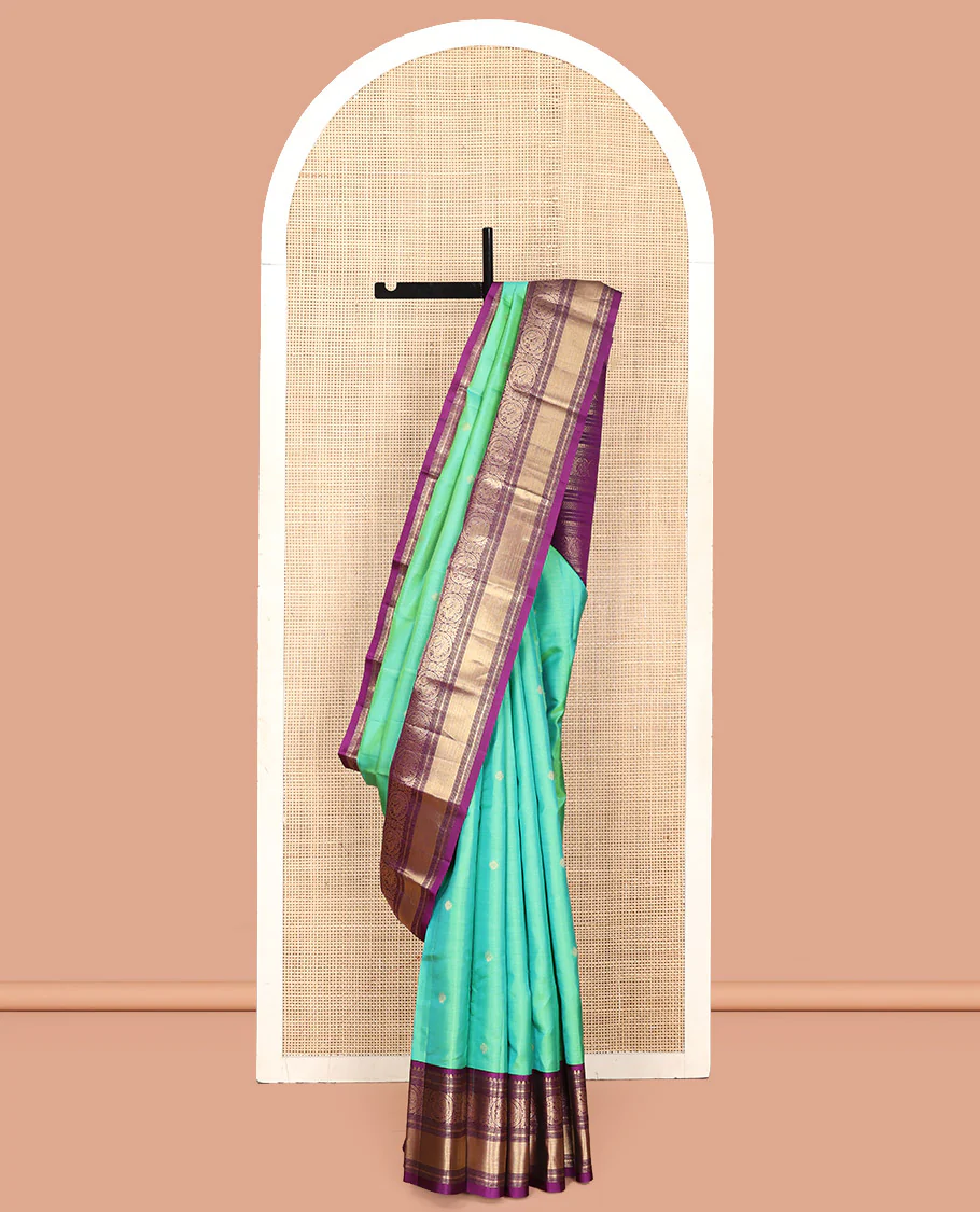 Rexona Green Vasundhara Silk Saree, Beautified with Sparse Stripes and Zari Buttas, Complemented by a Contrast Border of Thilakam, Banaras, Muthu, and Round Mayil Designs, Pallu Steeped with Traditional Designs, and Paired with a Contrast Blouse - Image 7