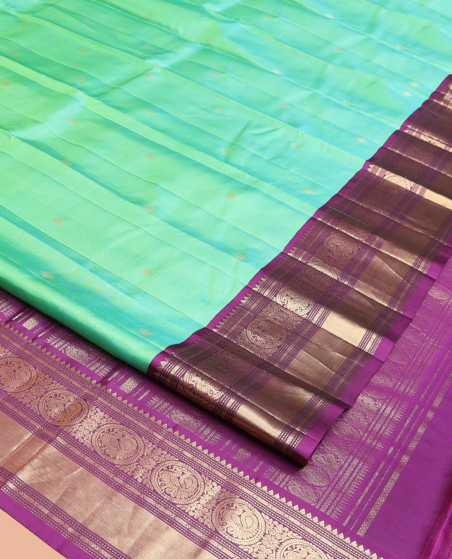 Rexona Green Vasundhara Silk Saree, Beautified with Sparse Stripes and Zari Buttas, Complemented by a Contrast Border of Thilakam, Banaras, Muthu, and Round Mayil Designs, Pallu Steeped with Traditional Designs, and Paired with a Contrast Blouse - Image 8