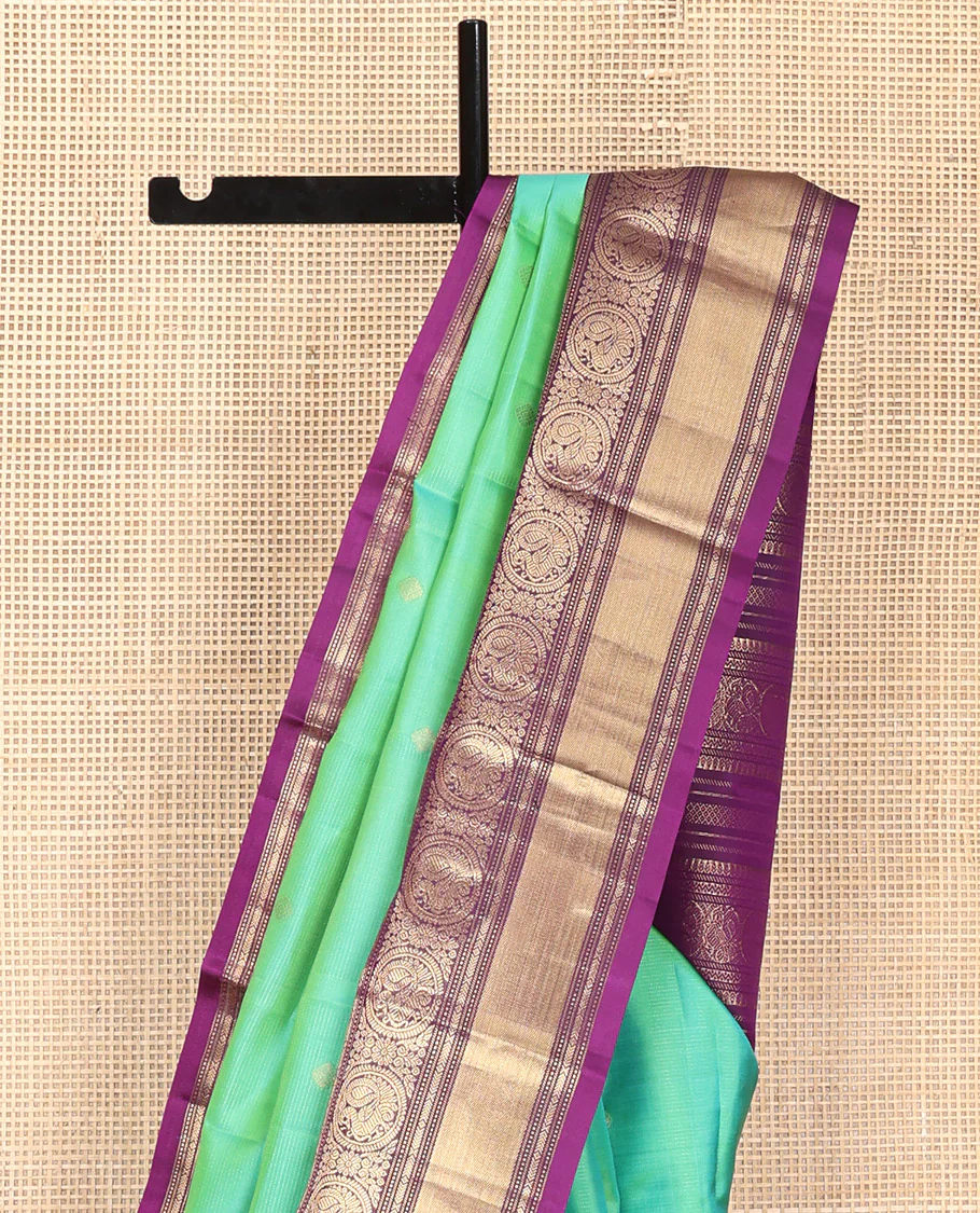 Rexona Green Vasundhara Silk Saree, Beautified with Sparse Stripes and Zari Buttas, Complemented by a Contrast Border of Thilakam, Banaras, Muthu, and Round Mayil Designs, Pallu Steeped with Traditional Designs, and Paired with a Contrast Blouse - Image 9