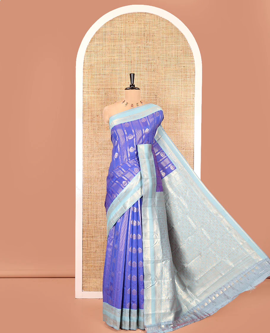 Royal Blue Litchi Saree, Detailed with Vaira Oosi Stripes and Zari Buttas on Its Body, Complemented by a Contrast Rettai Pettu Traditional Zari Design Border, an Intricately Designed Pallu, and Paired with a Contrast Blouse
