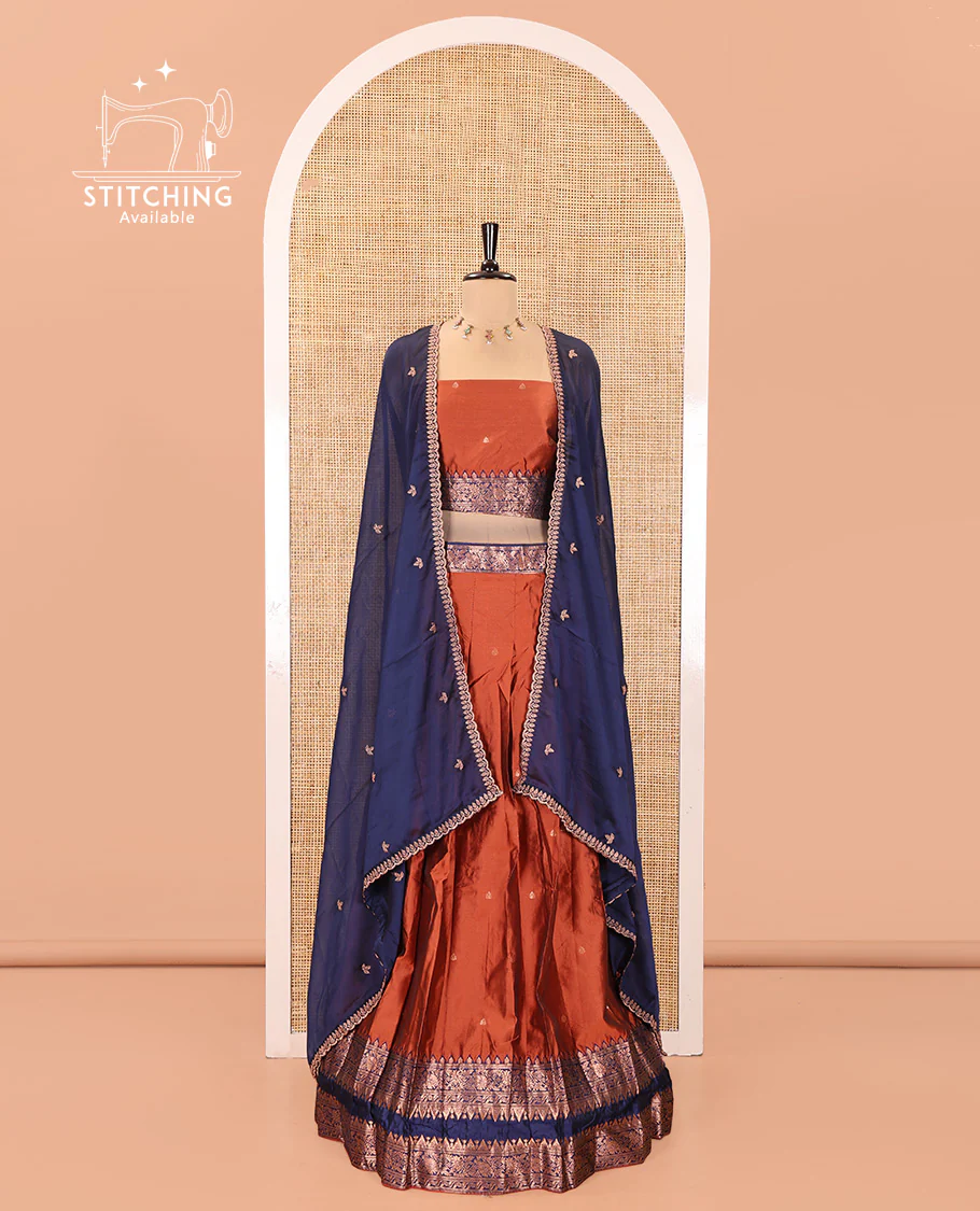 Rust and Blue Semi-Banarasi Half-Saree, Accentuated with Zari Buttas on Its Skirt, Complemented by a Contrast Rettai Pettu Traditional Zari-Design Border, Paired with a Matching Blouse, and Comes with a Contrast Satin Georgette Embroidered Dhavani - Image 2