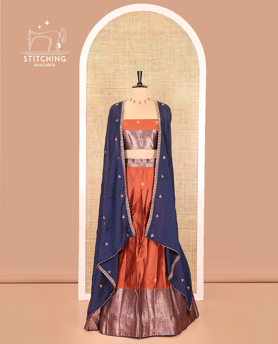 Rust and Navy Blue Semi-Banarasi Half-Saree, Embellished with Zari Buttas on Its Skirt, Complemented by a Contrast Traditional Zari Designs Woven Border, Paired with a Matching Blouse, and a Contrast Satin Georgette Embroidered Scallop Dhavani - Image 2