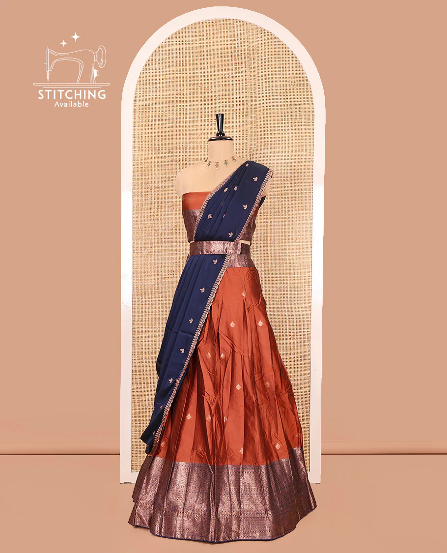 Rust and Navy Blue Semi-Banarasi Half-Saree, Embellished with Zari Buttas on Its Skirt, Complemented by a Contrast Traditional Zari Designs Woven Border, Paired with a Matching Blouse, and a Contrast Satin Georgette Embroidered Scallop Dhavani - Image 3