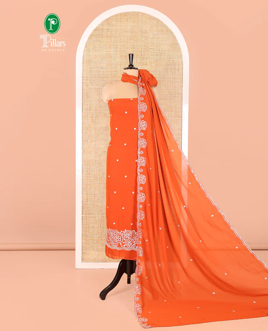 Rust Fox Georgette Material Chudidar Set, Woven with Floral Embroidery on Its Top, a Plain Santoon Bottom, and Paired with a Rose Floral Embroidered Scallop Dupatta