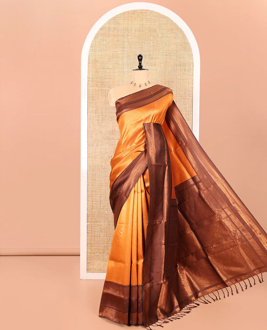 Rust Orange Kanchi Silk Saree Elevated with Floral Butta Enclosed Checks All Over Its Body, Complemented by Contrast Traditional Zari Rettai Pettu Border, Majestically Detailed Pallu, and Paired with a Contrast Blouse
