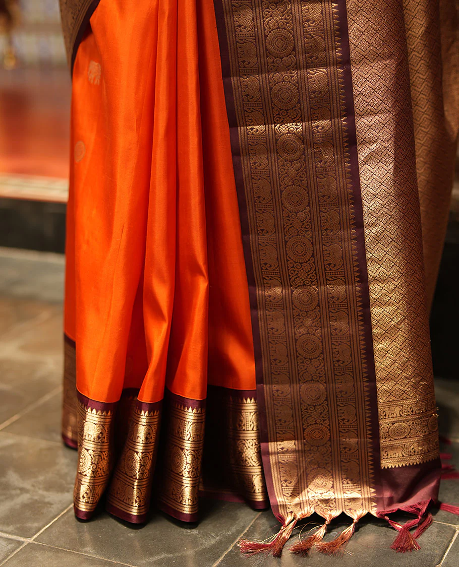Rust Orange Vasundhara Silk Saree, Embellished with Mayil and Yaanai Buttas Across Its Body, Complemented by a Contrast Korvai Border of Rekku, Banaras, Yaanai, and Chakram Designs, Gleaming Jaal Pallu, and Paired with a Contrast Blouse - Image 6