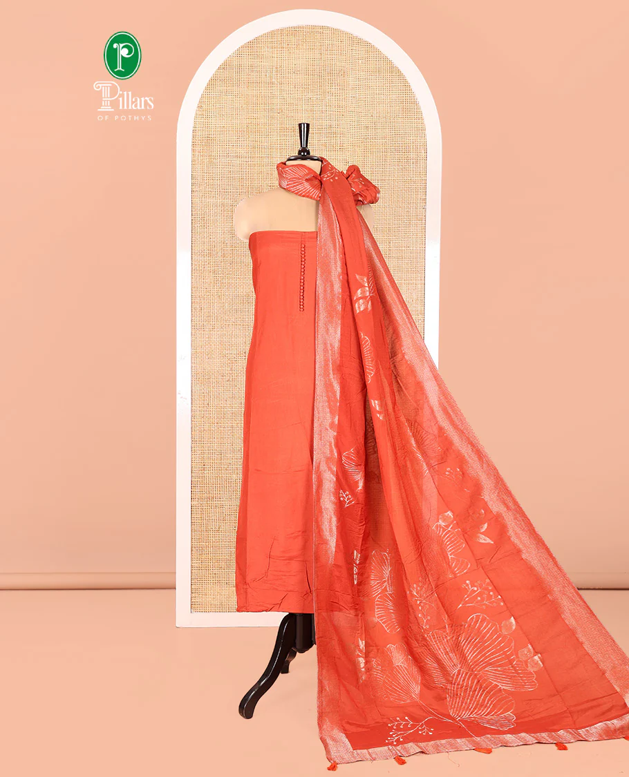 Rust Semi-Silk Material Chudidar Set, Adorned with Pom-Pom Necklined Top, a Plain Santoon Bottom, and Paired Floral Zari Woven Semi-Silk Dupatta