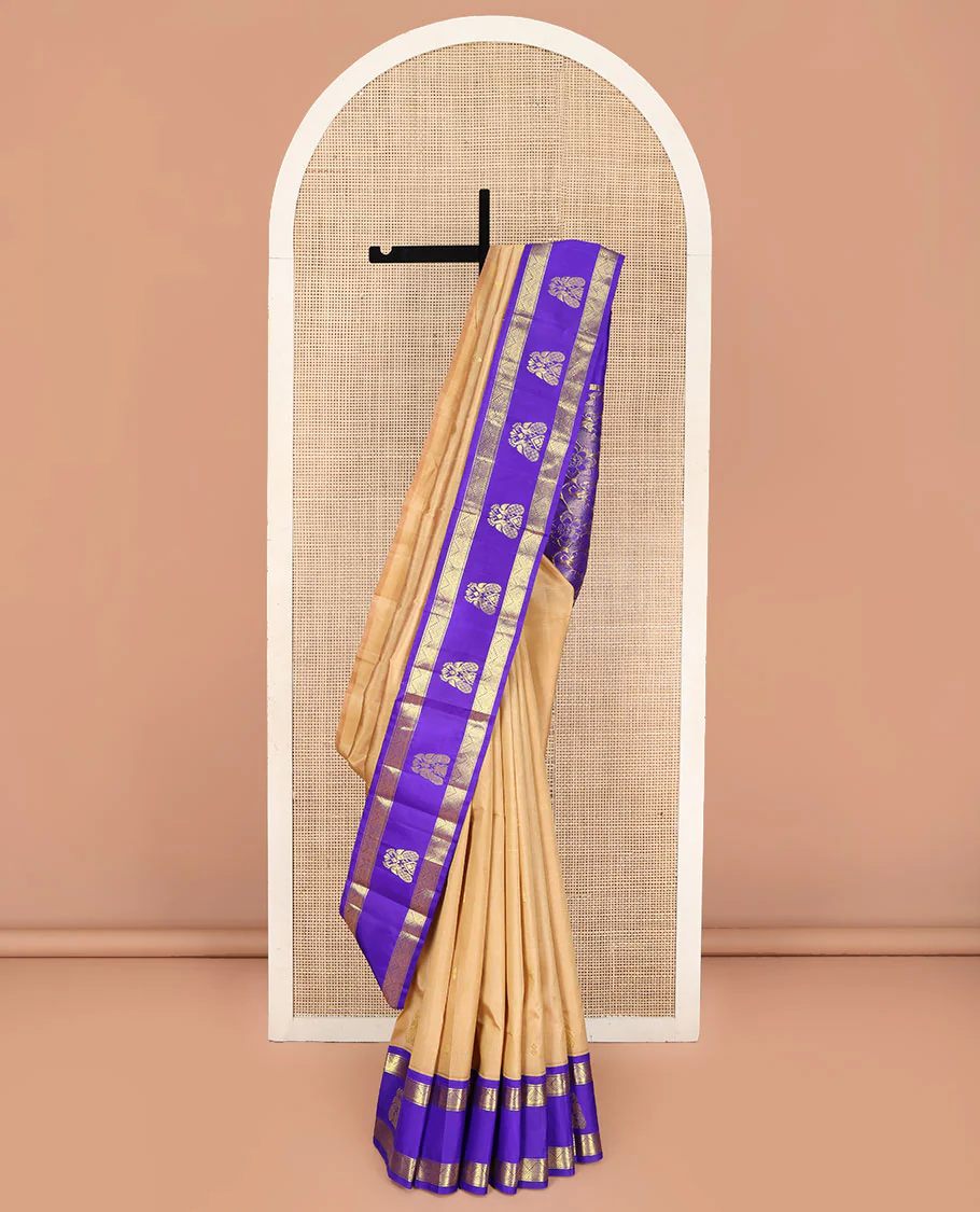 Sandal Kanchipuram Silk Saree, Highlighted with Zari Buttas on Its Body, Complemented by a Contrast One-Sided Korvai Border of Diamond and Mayil Designs, Pallu Features Floral and Paisley Designs, and Comes Without a Blouse