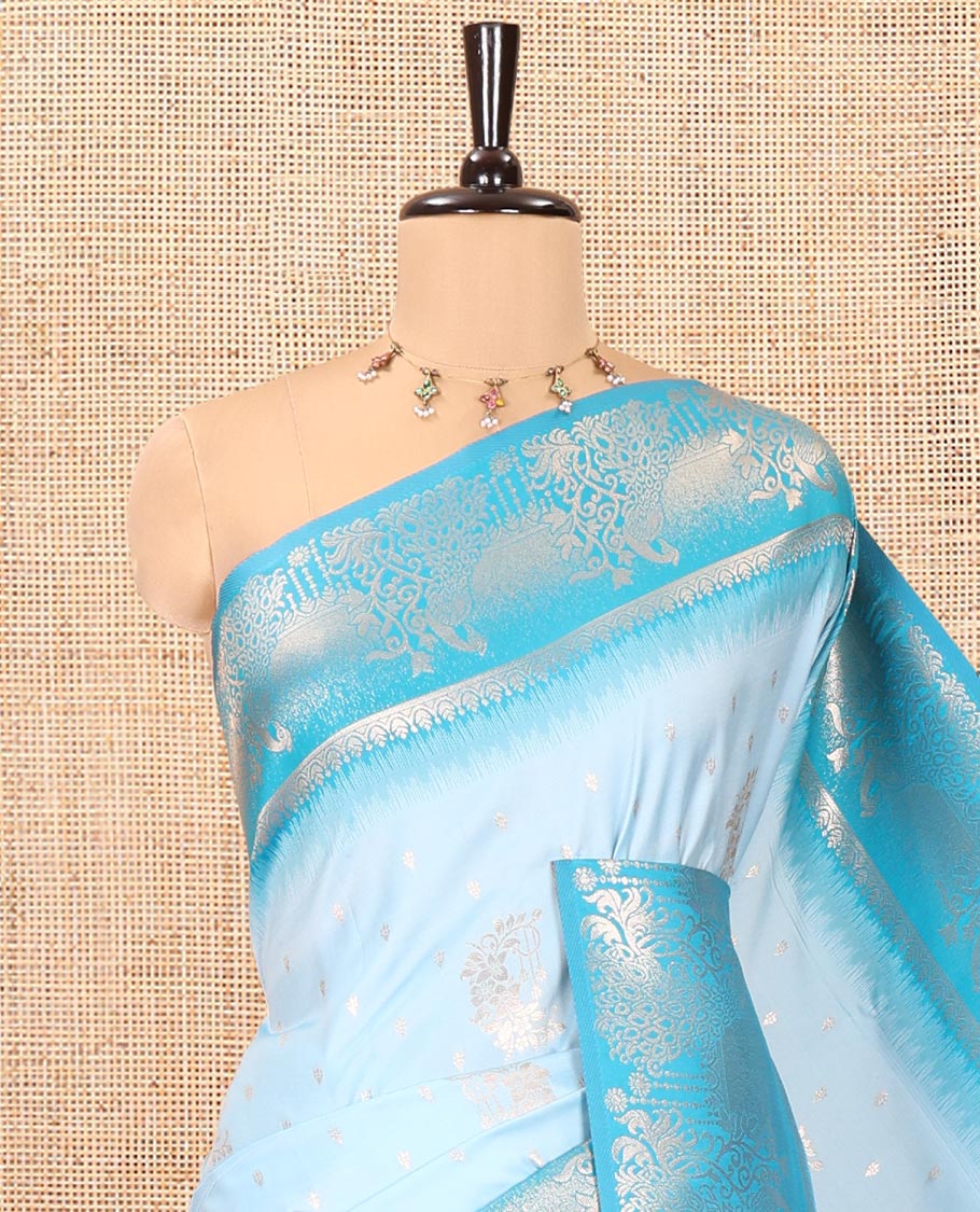 Sky Blue Elite Soft Silk Saree, Showcasing Zari Buttas on Its Body, Complemented by a Contrast Peacock-Floral Zari Blouse, Intricately Designed Pallu, and Paired with a Contrast Blouse - Image 2
