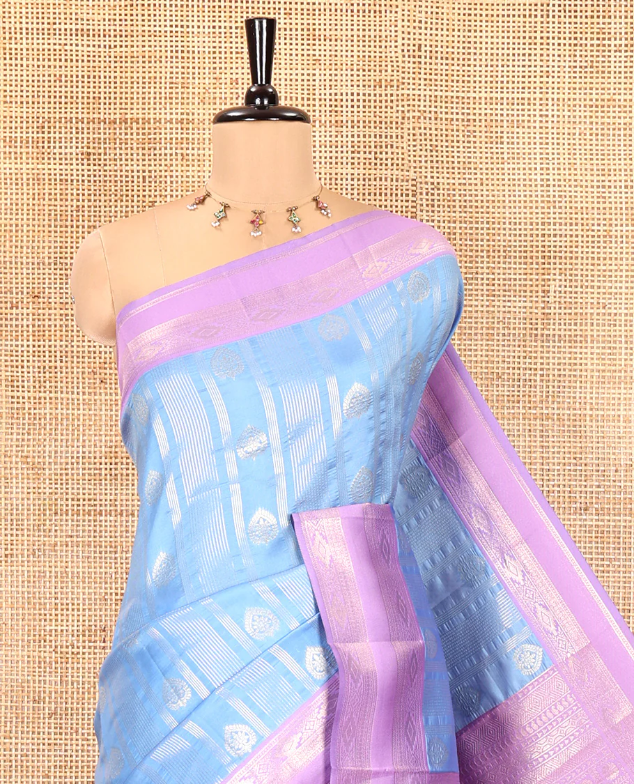 Sky Blue Litchi Saree, Enriched with Vaira Oosi Stripes and Zari Buttas on Its Body, Complemented by a Contrast Rettai Pettu Traditional Zari Design Border, an Intricately Designed Pallu, and Paired with a Contrast Blouse - Image 2