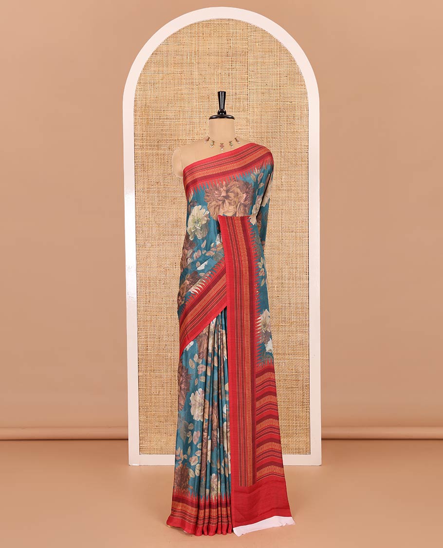 Teal blue floral printed Italian crepe saree, contrast temple printed border, striped pallu, and a printed bordered blouse - Image 2