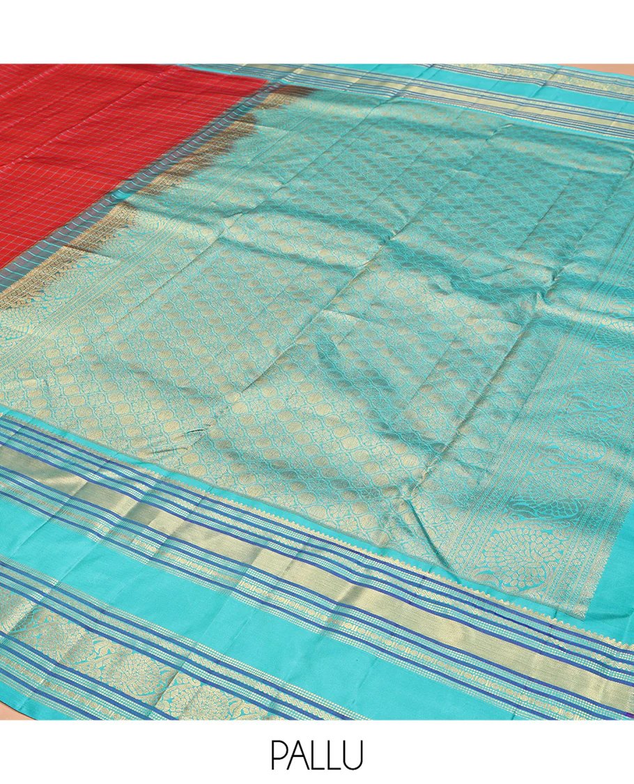 Tomato Red and Blue Vasundhara Silk Saree, Subtly Sparkled With Pattu Nool Kattam On Its Body, Complemented by Contrast Rettai Pettu Border of Salngai, Muthu, Neli, Rudraksham, and Dhavana Kodi Designs, Grand Pallu and Paired with a Contrast Blouse - Image 11