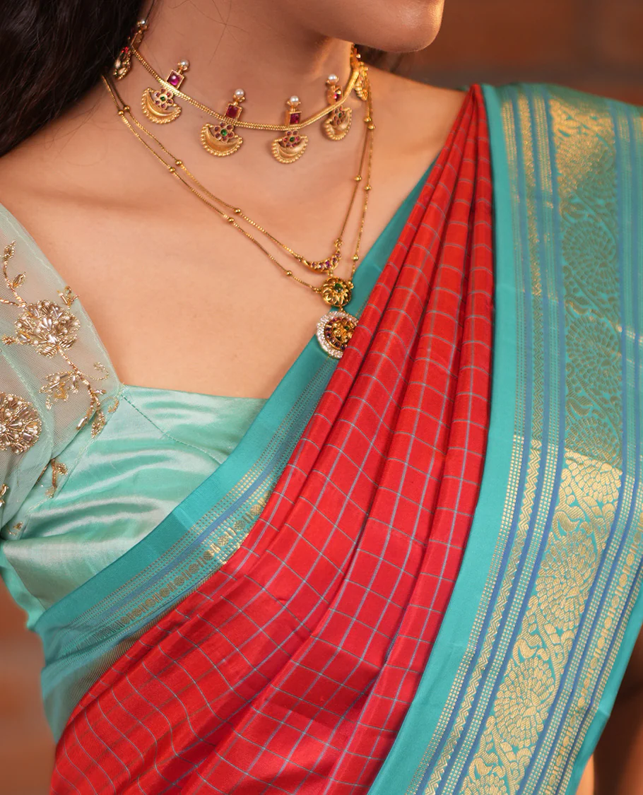 Tomato Red and Blue Vasundhara Silk Saree, Subtly Sparkled With Pattu Nool Kattam On Its Body, Complemented by Contrast Rettai Pettu Border of Salngai, Muthu, Neli, Rudraksham, and Dhavana Kodi Designs, Grand Pallu and Paired with a Contrast Blouse - Image 2