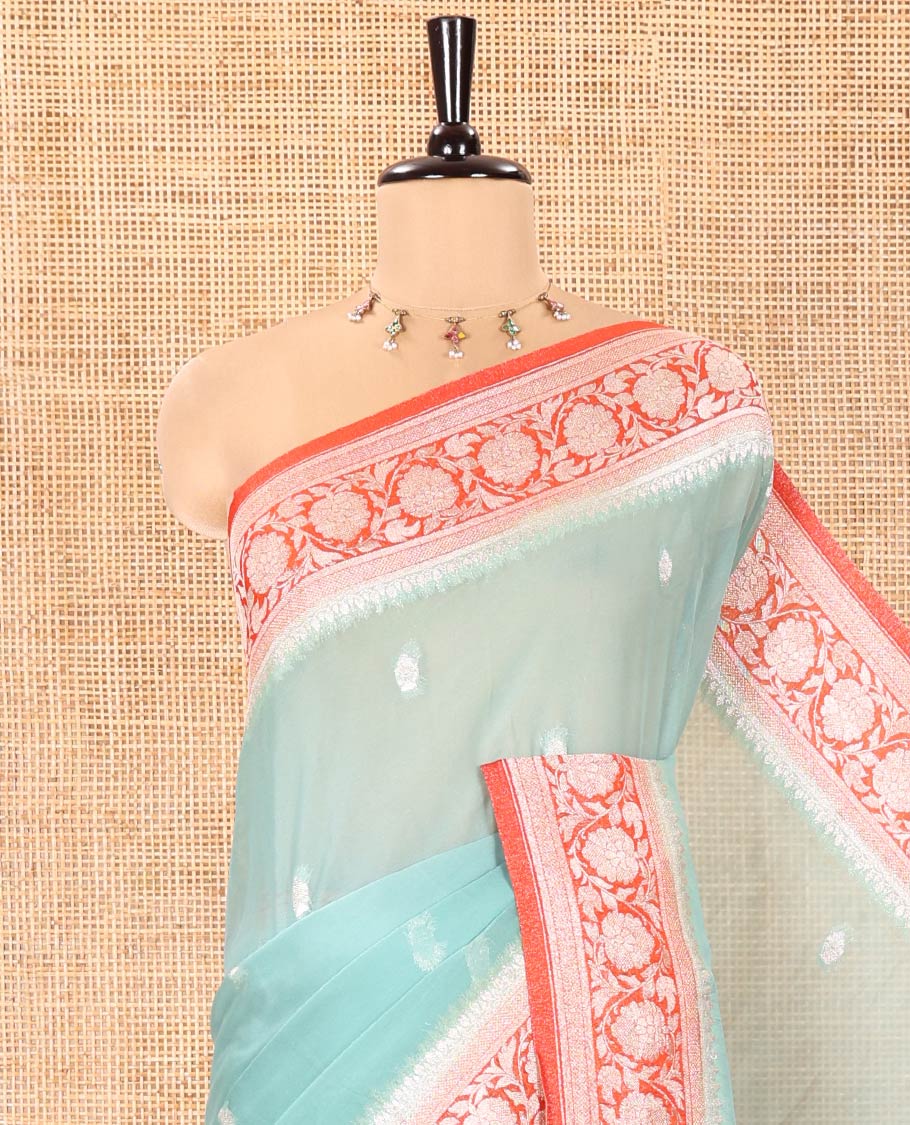 Turquoise Banaras Fancy Georgette Saree, Ornamented with Zari Buttas All Over Its Body, Complemented by a Contrast Floral Creeper Zari Border, Pallu Features Paisley Designs, and Paired with a Contrast Blouse - Image 2