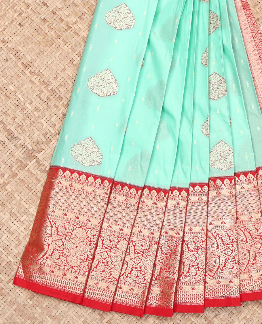 Turquoise Budget Silk Saree, Enlivened with Zari Buttas on Its Body, Complemented by a Contrast Traditional Zari Design Border, Grand Jaal Pallu, and Paired with a Contrast Blouse