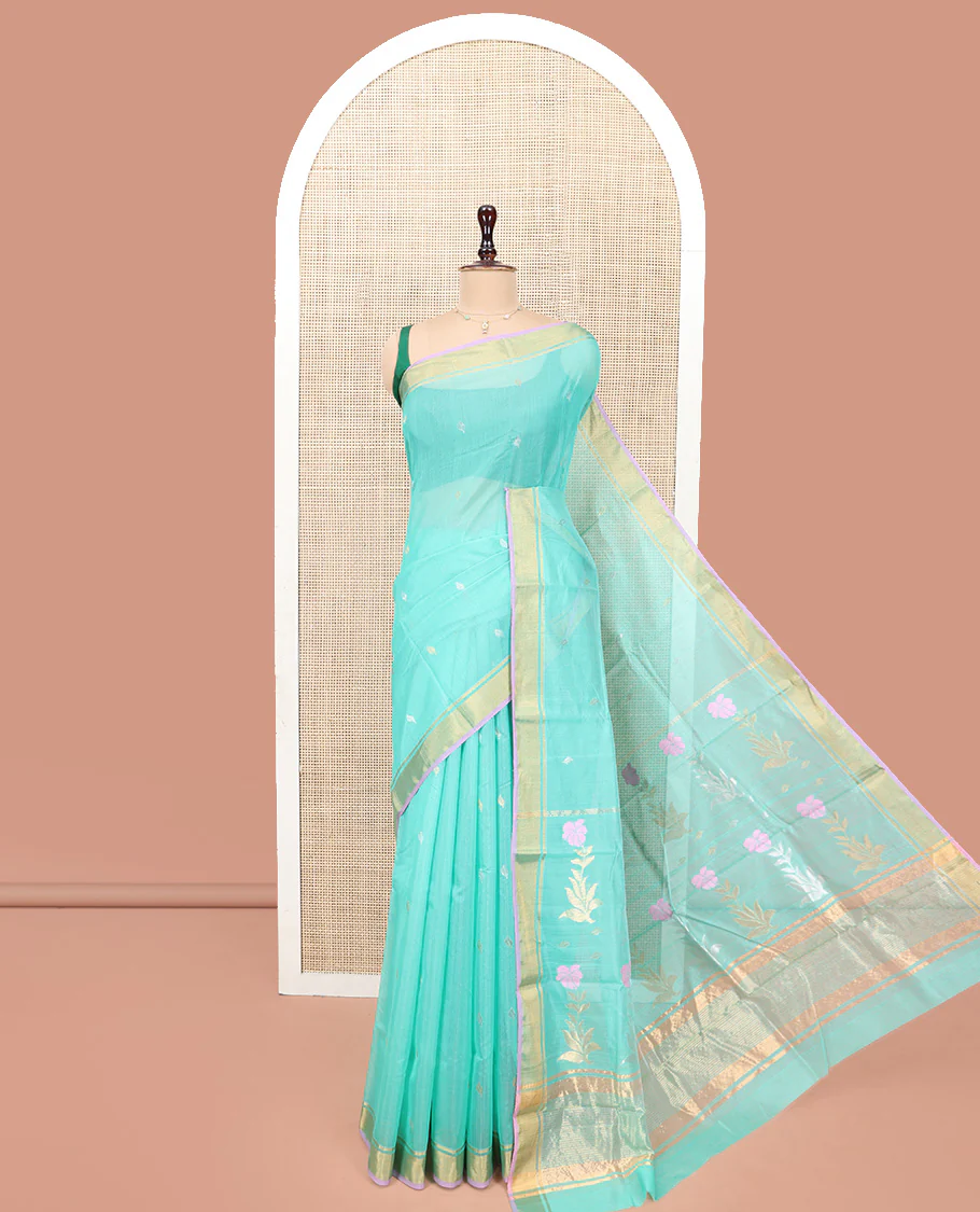 Turquoise Chanderi Cotton Saree, Enthralled with Zari Buttas All Over Its Body, Highlighted by a Zari Border, Pallu of Zari Stripes and Floral Buttas, and Paired with a Matching Blouse
