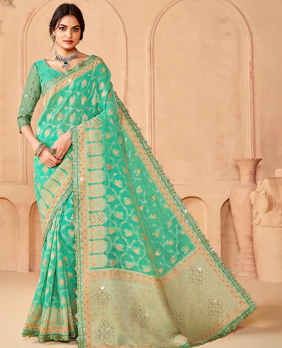 Turquoise jaal and micro-stone work designer saree, paisleys embroidered scallop border, and pallu of ogee patterns and stone work