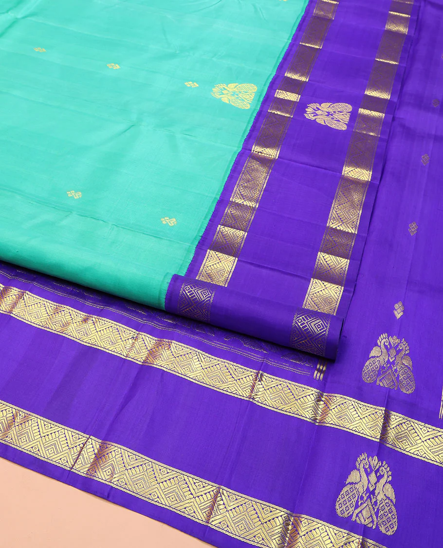 Turquoise Kanchipuram Silk Saree, Beautified with Zari Buttas on Its Body, Complemented by Contrast One-Sided Korvai Border of Diamond Designs, Pallu Steeped with Paisley and Floral Designs, and Comes Without a Blouse - Image 2