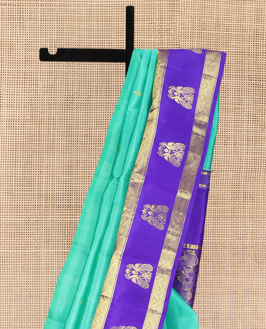 Turquoise Kanchipuram Silk Saree, Beautified with Zari Buttas on Its Body, Complemented by Contrast One-Sided Korvai Border of Diamond Designs, Pallu Steeped with Paisley and Floral Designs, and Comes Without a Blouse - Image 3