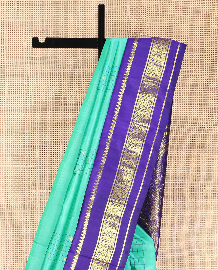 Turquoise Kanchipuram Silk Saree, Subtly Sparkled with Checked Buttas on Its Body, Complemented by a Contrast One-Sided Korvai Border of Thilakam Mokku, and Manga Designs, Pallu of Peacock Chariot Designs, and Comes Without a Blouse - Image 3