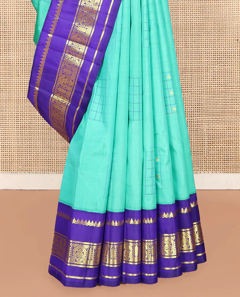 Turquoise Kanchipuram Silk Saree, Subtly Sparkled with Checked Buttas on Its Body, Complemented by a Contrast One-Sided Korvai Border of Thilakam Mokku, and Manga Designs, Pallu of Peacock Chariot Designs, and Comes Without a Blouse - Image 4