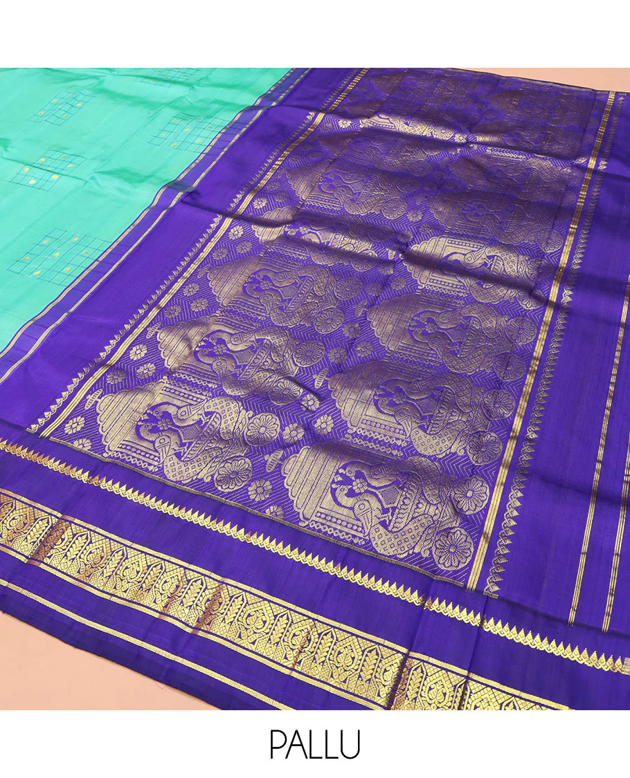 Turquoise Kanchipuram Silk Saree, Subtly Sparkled with Checked Buttas on Its Body, Complemented by a Contrast One-Sided Korvai Border of Thilakam Mokku, and Manga Designs, Pallu of Peacock Chariot Designs, and Comes Without a Blouse - Image 5