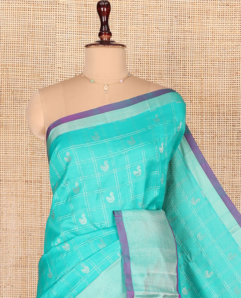Turquoise Kuppadam Cotton Saree, Subtly Woven with Zari Butta Enclosed Checks on Its Body, Highlighted by Zari Bavanji Border, Complemented by Contrast Intricately Designed Pallu, and Paired with a Contrast Blouse - Image 2