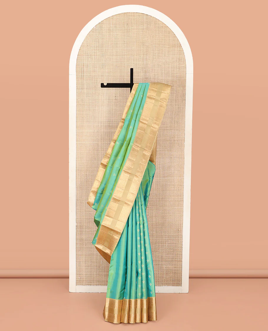 Turquoise Vasundhara Silk Saree, Crafted with Zari Buttas All Over Its Body, Complemented by a Contrast Rettai Pettu Border of Rekku, Muthu, Kathir, and Mayil Designs, Intricately Designed Pallu, and Paired with a Contrast Blouse