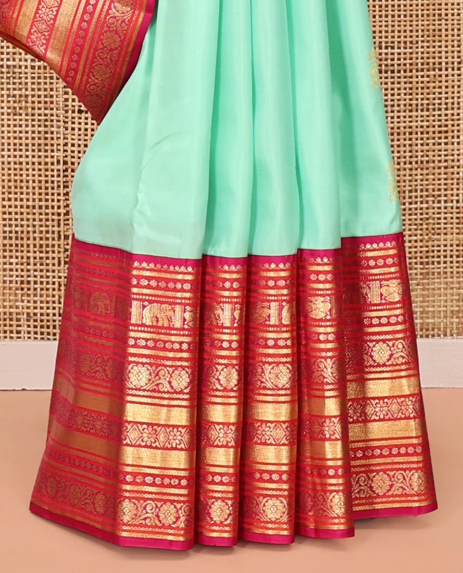 Turquoise Vasundhara Silk Saree, Embellished with Zari Buttas All Over Its Body, Complemented by a Contrast Border of Thilakam Mokku, Yaanai, Iruthalai Pakshi, and Kodi Visiry Designs, Grand Pallu, and Paired with a Contrast Blouse - Image 4