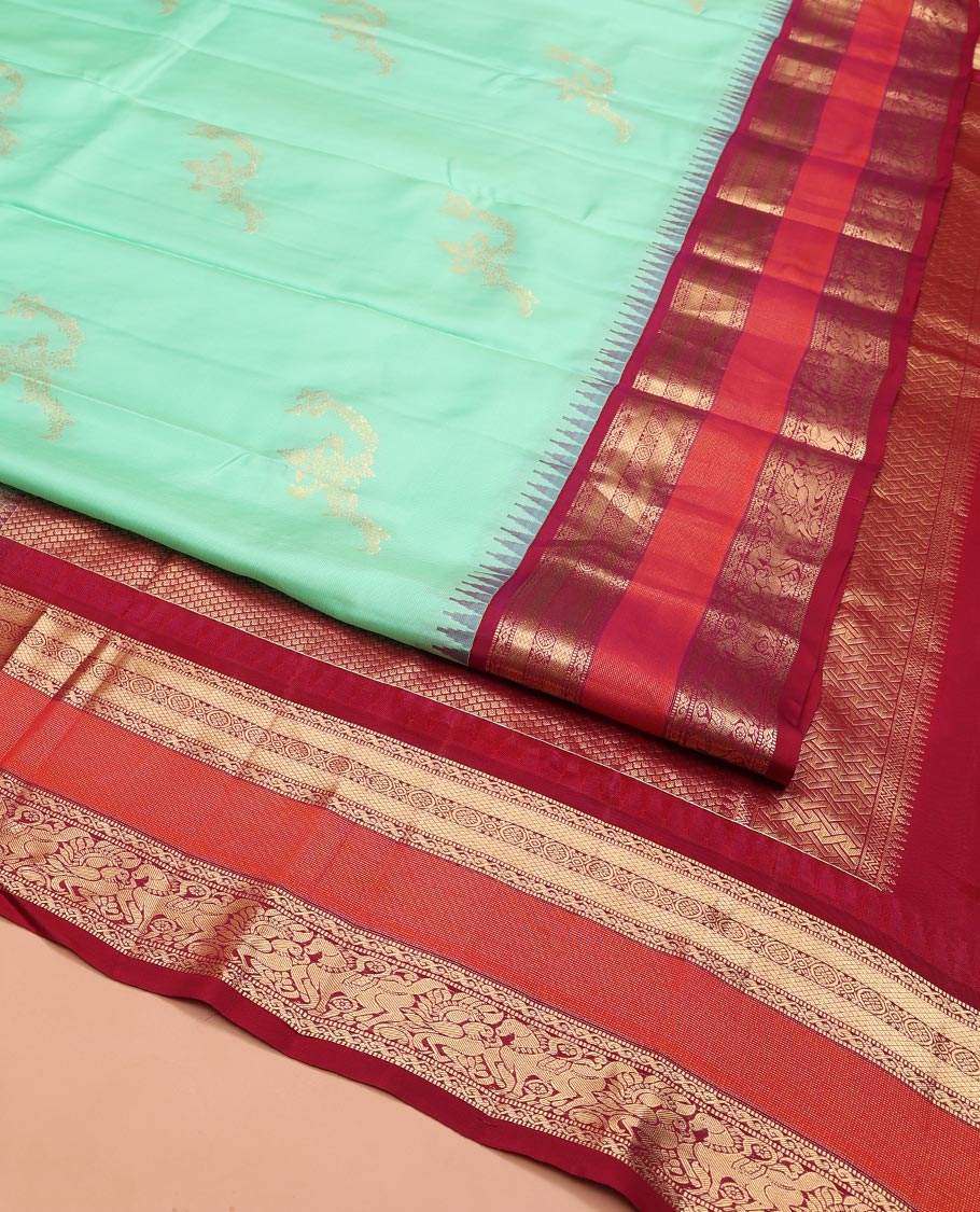 Turquoise Vasundhara Silk Saree, Meticulously Crafted with Zari Buttas on Its Body, Complemented by Contrast Border of Muthu, Mayil Kann, Chakram, Mayil, and Kuthirai Designs, an Intricately Designed Pallu, and Paired with a Contrast Blouse - Image 2