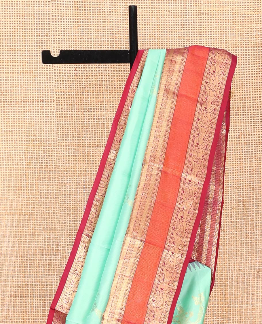 Turquoise Vasundhara Silk Saree, Meticulously Crafted with Zari Buttas on Its Body, Complemented by Contrast Border of Muthu, Mayil Kann, Chakram, Mayil, and Kuthirai Designs, an Intricately Designed Pallu, and Paired with a Contrast Blouse - Image 3