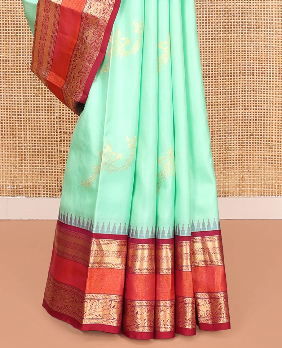 Turquoise Vasundhara Silk Saree, Meticulously Crafted with Zari Buttas on Its Body, Complemented by Contrast Border of Muthu, Mayil Kann, Chakram, Mayil, and Kuthirai Designs, an Intricately Designed Pallu, and Paired with a Contrast Blouse - Image 4