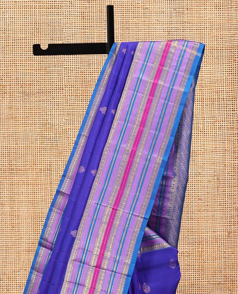 Violet and Mayil Blue Vasundhara Silk Saree, Subtly Sparkled with Zari Buttas All Over Its Body, Highlighted by Self-Border of Thilakam Mokku, Rudraksham, Muthu, and Mayil Kann Designs, Diagonally Striped Pallu, and Paired with a Matching Blouse - Image 3