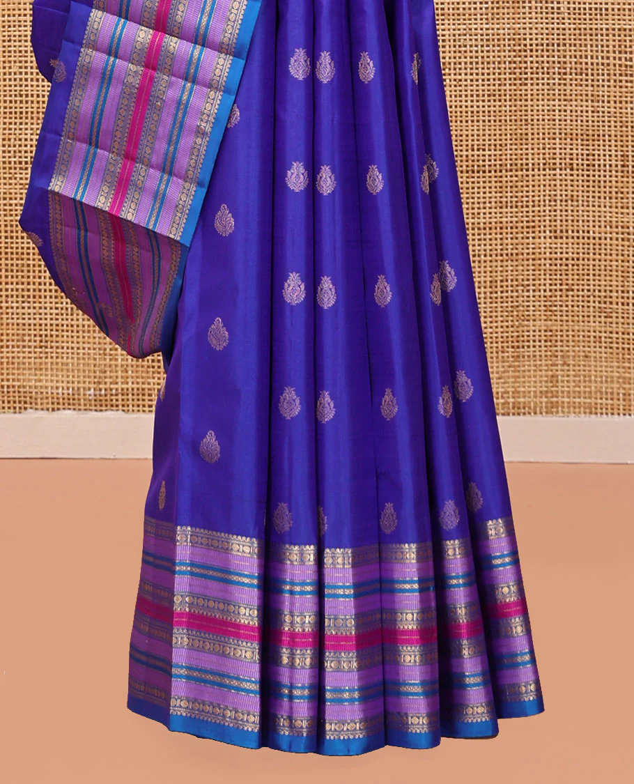 Violet and Mayil Blue Vasundhara Silk Saree, Subtly Sparkled with Zari Buttas All Over Its Body, Highlighted by Self-Border of Thilakam Mokku, Rudraksham, Muthu, and Mayil Kann Designs, Diagonally Striped Pallu, and Paired with a Matching Blouse - Image 4