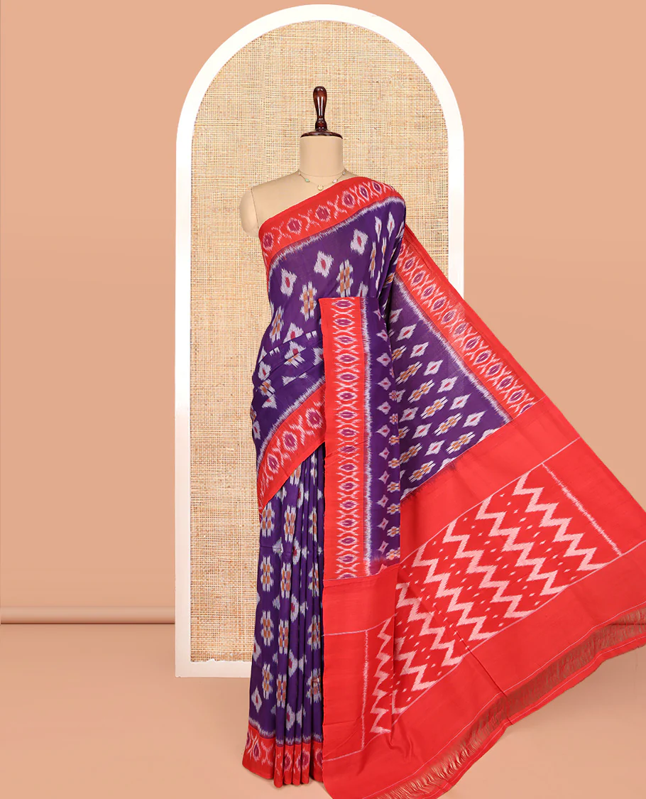 Violet Ikkat Cotton Saree, Showcasing Ikkat Buttas All Over Its Body, Complemented by a Contrast Ikkat-Style Border, Chevron Striped Pallu, and Paired with a Contrast Blouse