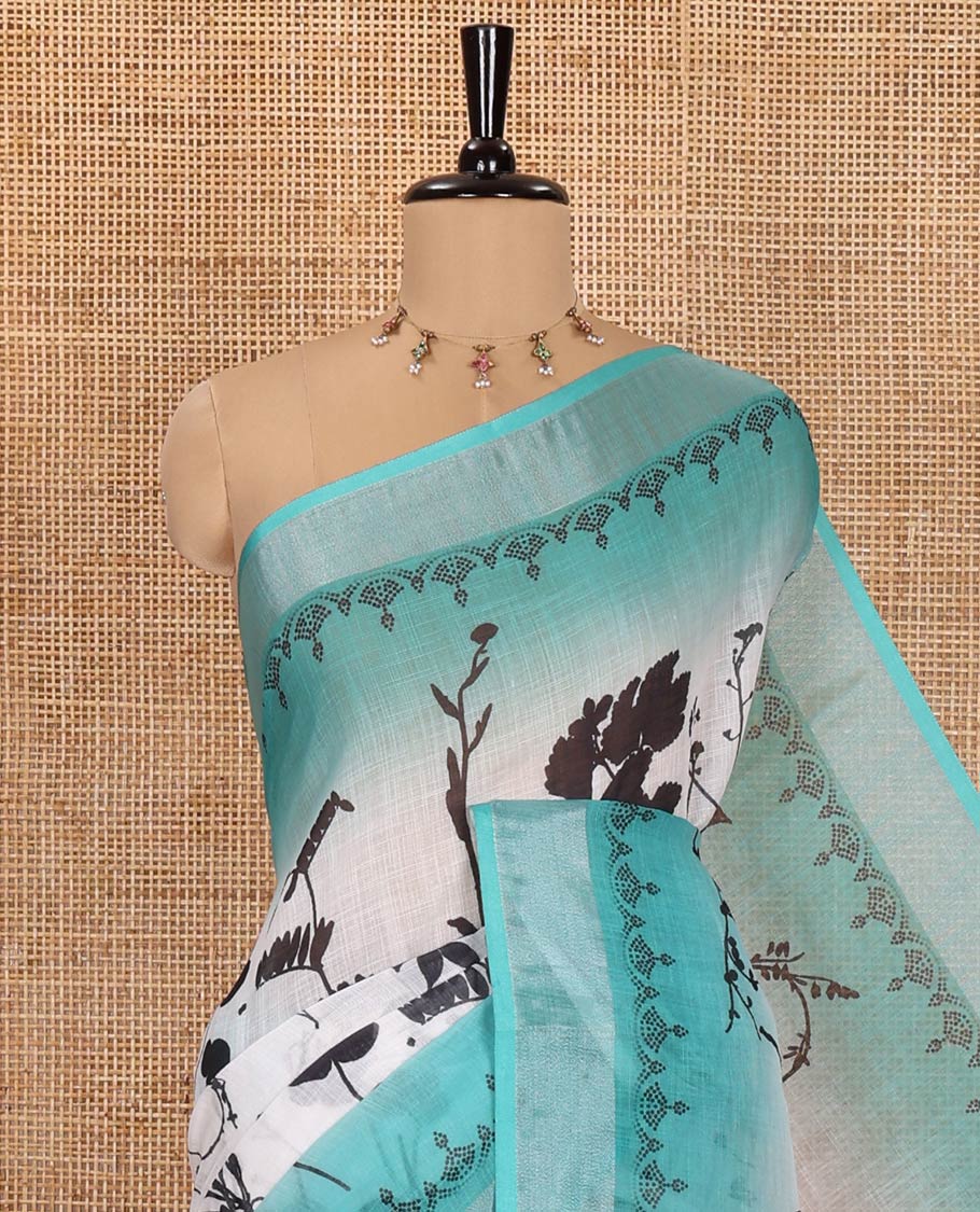 White and Rama Linen Cotton Saree, Bedecked with Silhouette-Style Floral Motifs Printed on Its Body, Complemented by Contrast Bavanji Border, Pallu of Silhouette-Style Floral Print, and Comes with a Matching Blouse - Image 2
