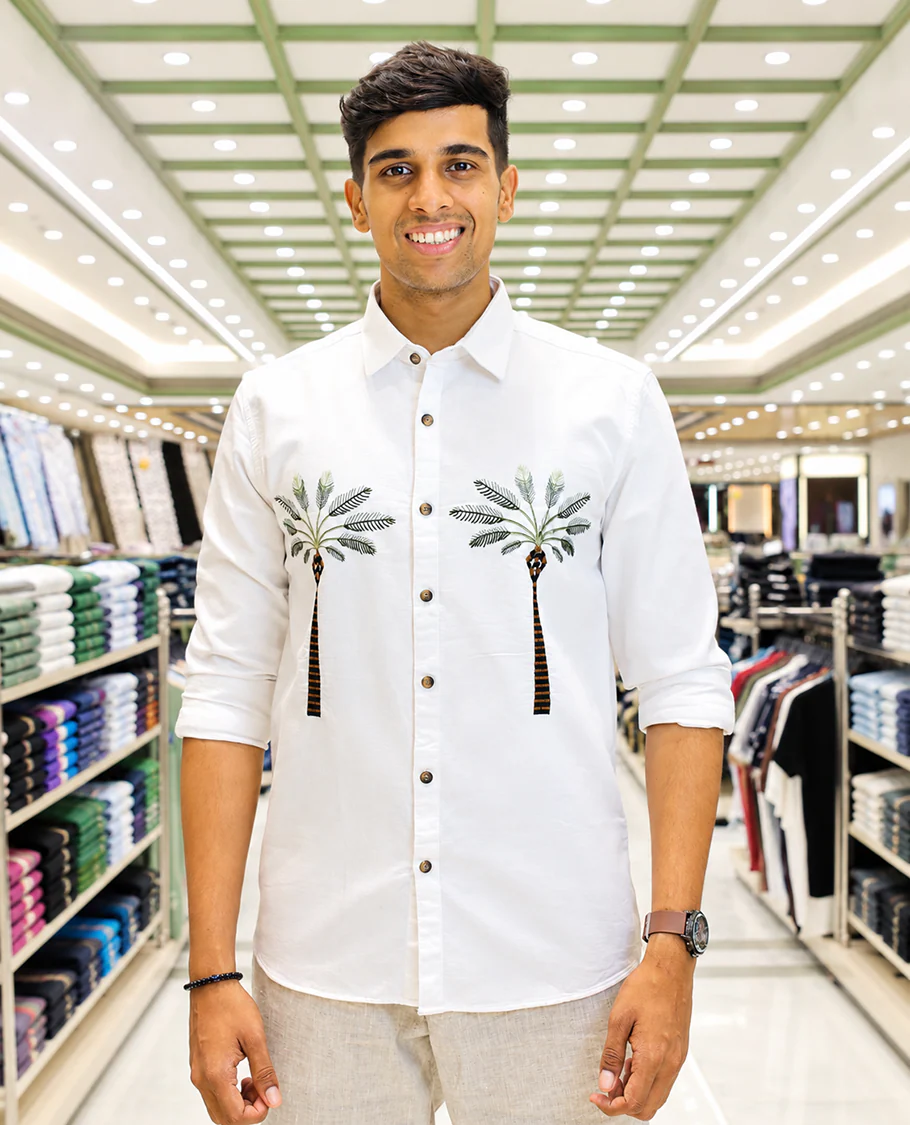 White Cotton-Blended Casual Shirt, Artfully Designed with Palm Tree Motifs Embroidery, Featuring a Spread Collar, Full Sleeves, Slim Fit, and Regular Length