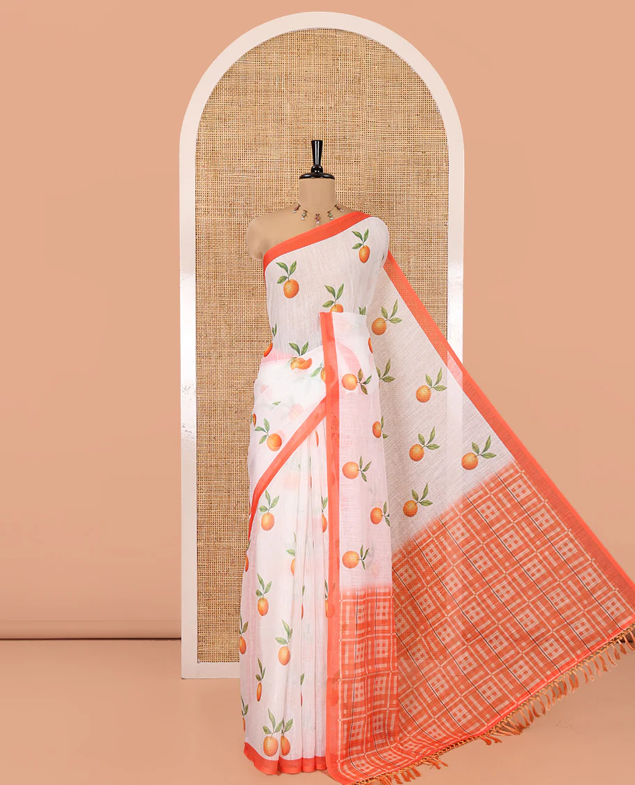 White Linen Cotton Saree, Artfully Printed with Orange Motifs All Over Its Body, Complemented by a Contrast Border, Geometric-Printed Pallu, and Paired with a Contrast Blouse