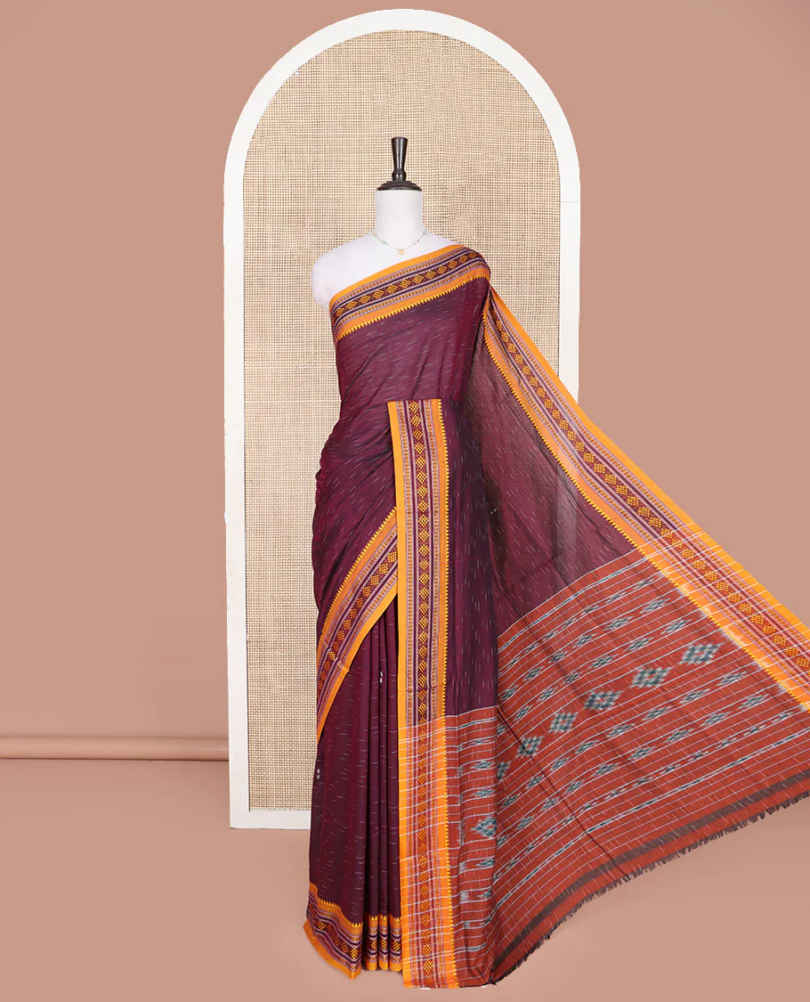 Wine Odisha Cotton Saree, Subtly Woven with Buttas All Over the Body, Complemented by a Contrast Temple Border of Geometric Thread Patterns, Pallu Depicts Geometric Patterns, and Paired with a Matching Blouse