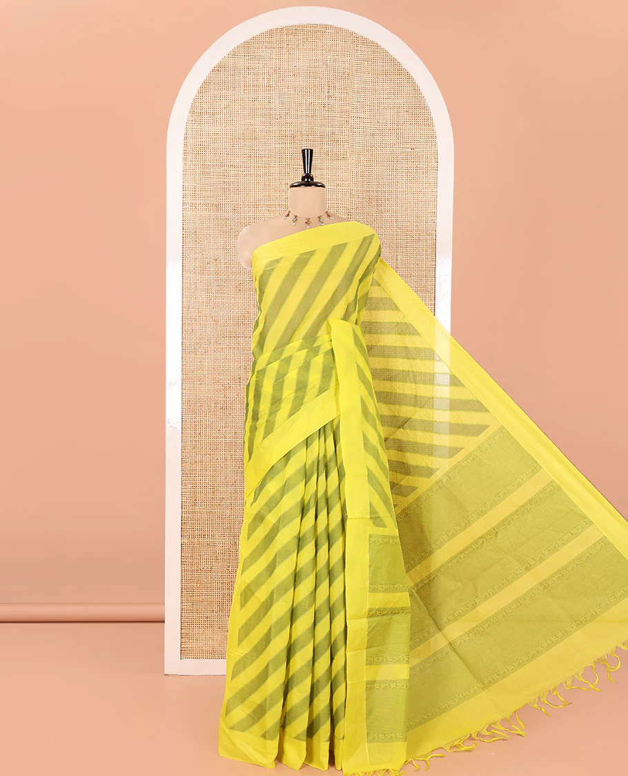 Yellow and Green Coimbatore Cotton Saree, Subtly Sparkled with Stripes on Its Body, Plain Border, Sparsely Sparkled Pallu of Floral Creeper Designs, and Paired with a Matching Blouse