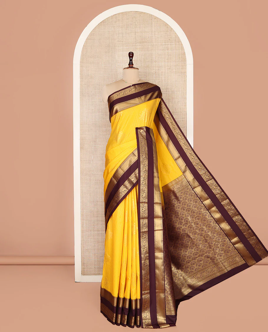 Yellow Budget Silk Saree, Embellished with Zari Stripes and Kolam Buttas All Over Its Body, Complemented by a Contrast Traditional Zari Design Rettai Pettu Border, Grand Scallop Design Pallu, and Paired with a Contrast Blouse