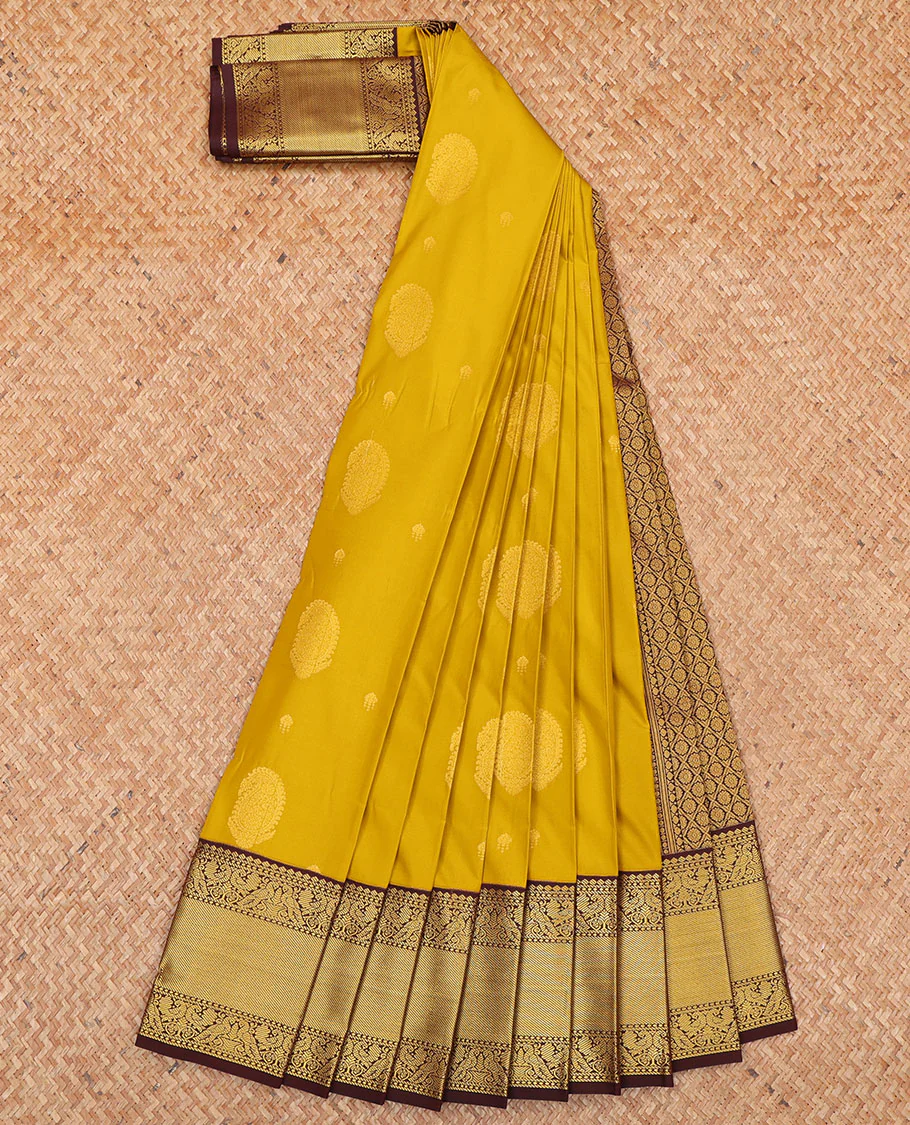 Yellow Budget Silk Saree, Subtly Sparkled with Paisley Buttas All Over Its Body, Complemented by a Contrast Traditional Zari Design Border of Peacock Designs, Opulently Embellished Pallu, and Paired with a Contrast Blouse - Image 2