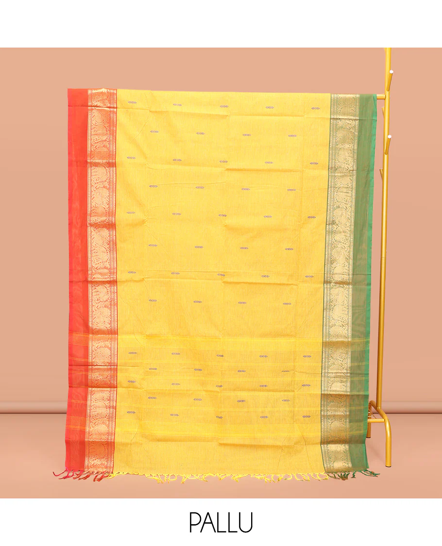 Yellow Chettinad Cotton Saree, Subtly Sparkled with Buttas All Over Its Body, Complemented by a Contrast Ganga-Jamuna Kal Eragina Border of Kodi Peacock and Elephant Designs, Pallu of Buttas and Stripes, and Paired with a Matching Blouse - Image 3