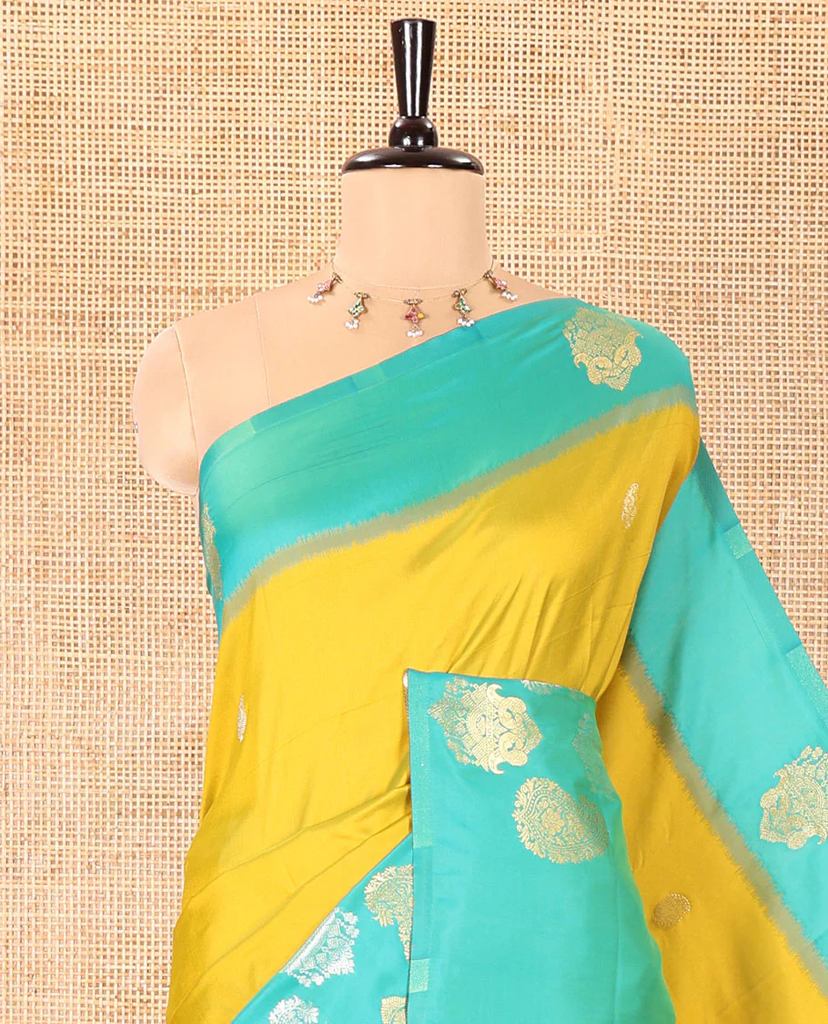 Yellow Elite Soft Silk Saree, Decorated with Zari Buttas All Over Its Body, Complemented by Contrast Border Steeped with Zari Buttas, Grand Jaal Design Pallu, and Paired with a Contrast Blouse - Image 2