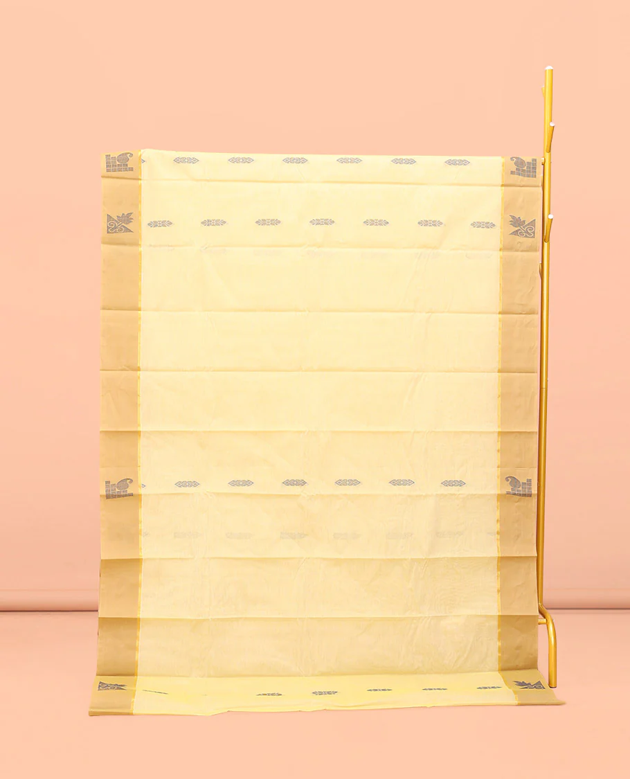 Yellow Kanchi Cotton Saree, Subtly Sparkled with Buttas All Over Its Body, Complemented by Contrast Border, Pallu of Floral Designs, and Paired with a Matching Blouse